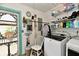 Bright laundry room with shelving and laundry equipment at 121 Mulberry Dr, Chesterfield, IN 46017