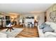 Spacious living room with hardwood floors and a fireplace, perfect for gatherings at 121 Mulberry Dr, Chesterfield, IN 46017