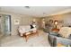 Comfortable living room with neutral walls, comfortable seating, and door at 121 Mulberry Dr, Chesterfield, IN 46017