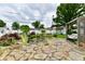 A beautifully landscaped pond with a seating area and koi fish at 121 Mulberry Dr, Chesterfield, IN 46017