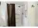 Shower stall with a brown curtain and mounted shower head at 121 Mulberry Dr, Chesterfield, IN 46017
