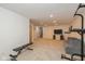 Finished basement area with neutral carpet, recessed lighting, exercise equipment and access to the upper levels at 12772 Tram Ln, Carmel, IN 46032