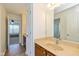Hallway bathroom with tan counters and tile floors at 12772 Tram Ln, Carmel, IN 46032