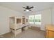 Charming bedroom with a unique, custom-built loft bed and bright natural light from a large window at 12772 Tram Ln, Carmel, IN 46032