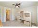 Bedroom with light-colored walls and carpet, featuring a ceiling fan and whimsical bunk bed at 12772 Tram Ln, Carmel, IN 46032