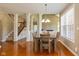 Dining room featuring wood table and staircase at 12772 Tram Ln, Carmel, IN 46032