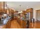 The gourmet kitchen boasts granite countertops, stainless steel appliances, double ovens, and a central island at 12772 Tram Ln, Carmel, IN 46032