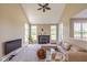 Spacious living room featuring a vaulted ceiling, fireplace, and comfortable seating at 12772 Tram Ln, Carmel, IN 46032