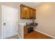 Handy office nook off the kitchen with cabinets, countertops, and extra storage, near the back door at 12772 Tram Ln, Carmel, IN 46032