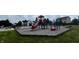 Community playground featuring a slide, swings, and play area for outdoor fun at 12772 Tram Ln, Carmel, IN 46032