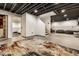 Finished basement space with exposed ceiling, painted floors and bedroom nook at 14149 Ledgewood Way, Carmel, IN 46032