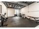 Home gym featuring weight racks, workout equipment and exposed ceiling at 14149 Ledgewood Way, Carmel, IN 46032