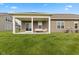 Well-maintained backyard featuring a covered patio, ideal for enjoying the outdoors at 14848 Stonneger St, Westfield, IN 46074