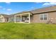Spacious backyard with a covered patio, perfect for outdoor entertaining and relaxation at 14848 Stonneger St, Westfield, IN 46074