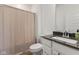 Well-lit bathroom featuring a modern sink with dark countertops and a convenient shower at 14848 Stonneger St, Westfield, IN 46074