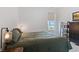 Cozy bedroom featuring neutral tones, natural light, and a view of the outdoors through a window at 14848 Stonneger St, Westfield, IN 46074
