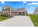 Beautiful home featuring an attached garage, brick accents, and a covered front porch at 14848 Stonneger St, Westfield, IN 46074
