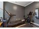 Dedicated home gym featuring a treadmill, stationary bike, and durable flooring at 14848 Stonneger St, Westfield, IN 46074