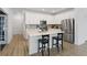 Spacious eat-in kitchen featuring white cabinets, quartz countertops, and stainless steel appliances at 14848 Stonneger St, Westfield, IN 46074