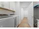 Functional laundry room with new Samsung washer and dryer and ample cabinet space at 14848 Stonneger St, Westfield, IN 46074