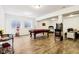 This basement includes a pool table, dart board, arcade games, and a popcorn machine at 1521 Avondale Dr, Westfield, IN 46074