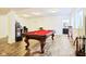 The basement offers a pool table and arcade machine for entertainment at 1521 Avondale Dr, Westfield, IN 46074