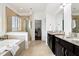 Bathroom with double vanity, walk-in glass shower, and soaking tub at 1521 Avondale Dr, Westfield, IN 46074
