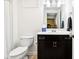 A bathroom is equipped with a toilet and a dark brown vanity at 1521 Avondale Dr, Westfield, IN 46074