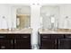 Bathroom featuring a double vanity with granite countertops and a large mirror at 1521 Avondale Dr, Westfield, IN 46074