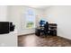 Home office featuring a modern desk, ergonomic chair, computer, and natural light at 1521 Avondale Dr, Westfield, IN 46074