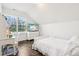 Bright bedroom features white furniture, dark wood floors, and a large window with shutters at 1521 Avondale Dr, Westfield, IN 46074