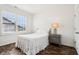 Cozy bedroom with natural light from window and a comfortable bed with side table at 1521 Avondale Dr, Westfield, IN 46074