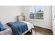 Bright bedroom with wood flooring, a full window, and rustic-chic furnishings at 1521 Avondale Dr, Westfield, IN 46074