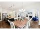 Open concept kitchen and dining area with sightlines into the living room and foyer at 1521 Avondale Dr, Westfield, IN 46074