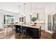 Beautiful kitchen features a center island with seating, granite countertops, and dining area at 1521 Avondale Dr, Westfield, IN 46074