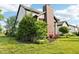 Well-maintained lawn with attractive landscaping including rose bushes and mature greenery at 1521 Avondale Dr, Westfield, IN 46074