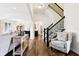 Open-concept living area with hardwood floors, seamlessly connecting the living and dining spaces at 1521 Avondale Dr, Westfield, IN 46074