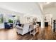Bright and airy living room with hardwood floors, large windows, and an open-concept layout at 1521 Avondale Dr, Westfield, IN 46074