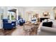 Bright and airy living room with hardwood floors and view of the dining area at 1521 Avondale Dr, Westfield, IN 46074
