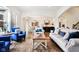 Open-concept living room with hardwood floors, comfortable seating, and view of the kitchen at 1521 Avondale Dr, Westfield, IN 46074