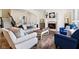 Bright living room boasts hardwood floors, fireplace, and comfortable seating at 1521 Avondale Dr, Westfield, IN 46074