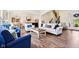 Cozy living room with hardwood floors, comfortable seating, and view of the kitchen at 1521 Avondale Dr, Westfield, IN 46074