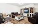 A cozy living room, featuring a comfortable leather sofa and entertainment center with a built-in TV at 1521 Avondale Dr, Westfield, IN 46074