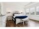 Bright main bedroom with tray ceilings, wood floors, and plantation shutters at 1521 Avondale Dr, Westfield, IN 46074