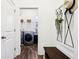 Practical mudroom featuring a bench with storage and access to the laundry area at 1521 Avondale Dr, Westfield, IN 46074