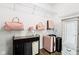 Organized walk-in closet featuring shelves with personal belongings and a decorative armoire at 1521 Avondale Dr, Westfield, IN 46074
