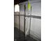 Unfinished basement area featuring storage racks along the textured wall at 1641 Winton Ave, Speedway, IN 46224