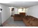 Finished basement with comfortable seating and carpeting at 1641 Winton Ave, Speedway, IN 46224