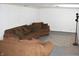 Finished basement featuring neutral colored furniture and carpeting at 1641 Winton Ave, Speedway, IN 46224