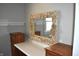 Vanity area featuring custom mirror decorated with seashells, adding a unique touch to the bathroom at 1641 Winton Ave, Speedway, IN 46224